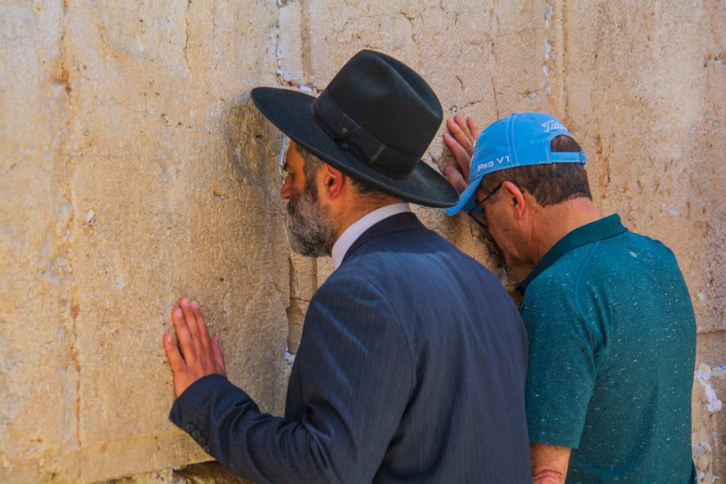 praying at the western wall in Jerusalem 